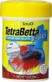 A yellow container of Tetra TetraBetta Plus floating mini pellets for fish features a vibrant betta on the label, highlights natural color enhancers, supports the immune system, and has a net weight of 1.2 oz (35g).