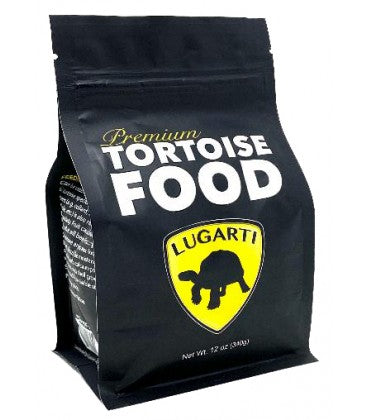 A black 12 oz bag of Lugarti Premium Tortoise Food with a yellow shield logo featuring a tortoise silhouette, displaying text in white and yellow.